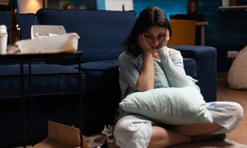 Lonely, traumatised, frustrated, ill woman holding head in hands, feeling vulnerable, desperate having bipolar problems, needs psychological help, major heartbroken experiencing loneliness crisis